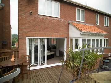 Mrs R: Hoylake Wirral : 70c Bi Fold doors in white PvcU . 